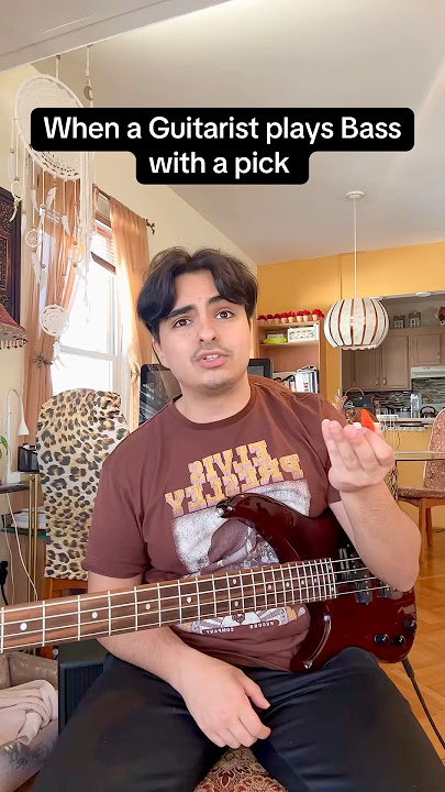 When a guitarist plays Bass with a pick