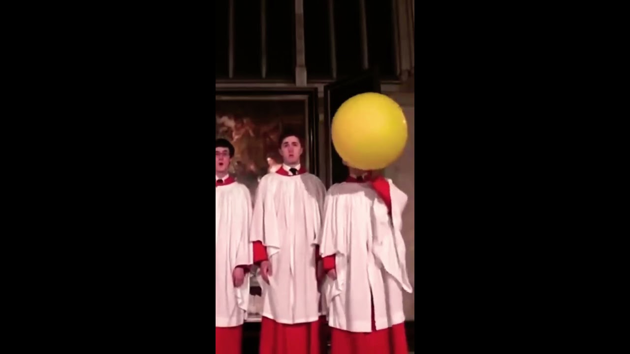 Choir Boy Using Helium Balloon