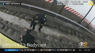 NYPD body cam video shows officers rescuing woman from subway tracks