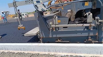 Laying of Dense Bitumen Macadam (DBM) by Paver