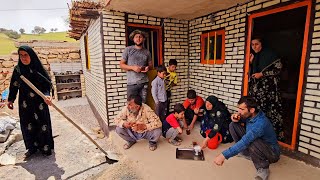 Rural family. Tahmorth cements the roof of the house to prevent its destruction #building