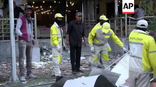 Aftermath of car bomb which killed 14 and wounded 23