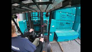 Forklift POV: Unloading a Truck of OSB