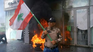 Angry Lebanese depositors vandalise banks in Beirut suburb | AFP