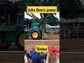 🚜 Big john deere pulls a person through the sand in a rodeo show