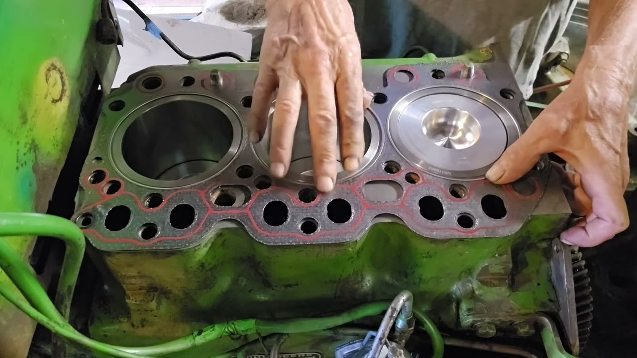 Set the head & fill sleeve resivor on 1530 John Deere