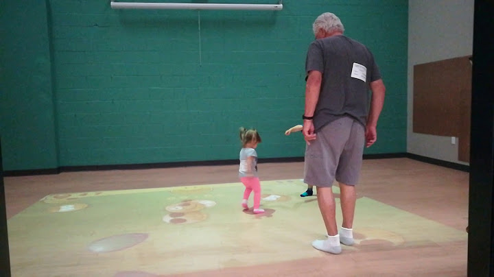 Gracie, Cyrus and Grandpa "popping" balloons at Romp-o-Rama