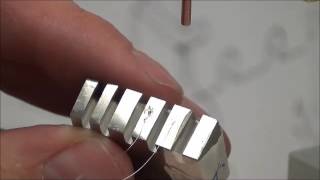 Sunstone CD100SPM welder with opposed weld head welding platinum wire to inconel base
