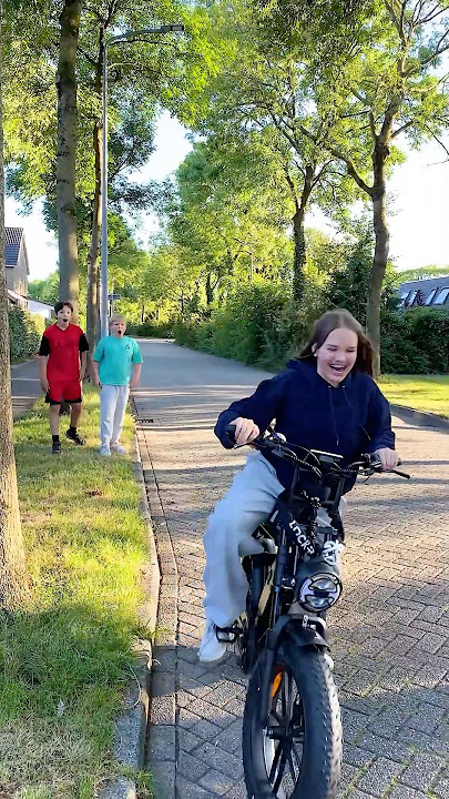 Avelina rides on Akim’s new bike