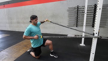 Half kneeling single arm banded cuban rotations