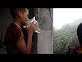 A sikkimese monk blowing conch shell