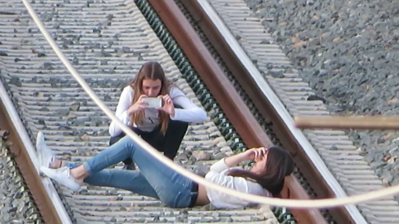 Young Girl Laying On A Railway Against Summer Landscape Hoodoo Wallpaper 