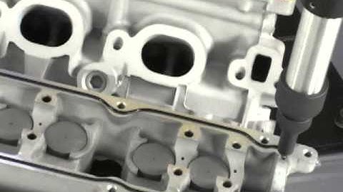 Application of adhesive using robotics and NETZSCH Dispensing Pump to engine block