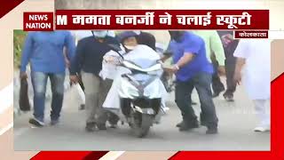 West Bengal CM Mamata Banerjee nearly falls while driving electric scooter