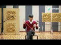 Kong Ming performs on the traditional Chinese Jinghu instrument