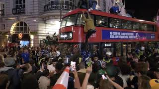 London Erupts With Fans Climbing On Buses As England Celebrate Football Win