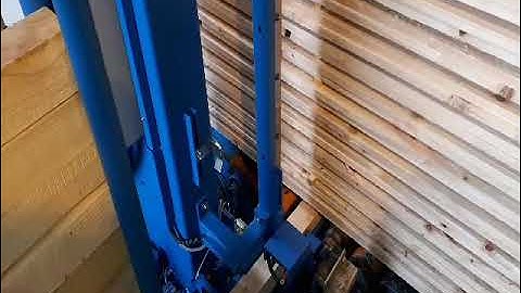 Auto strapping machine for timber industry with bottom bearer applicator
