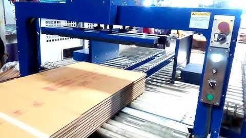 Corrugated box bundle squaring with strapping machine