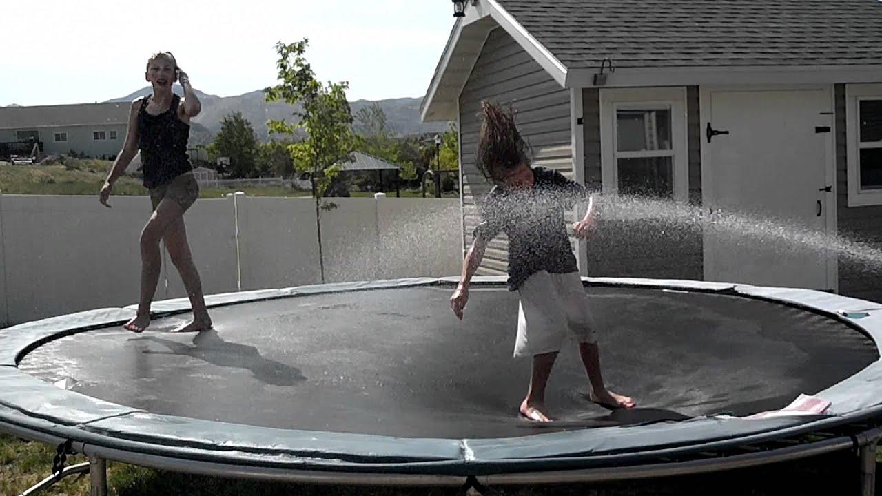 Chris and Haileigh wet trampoline high jump - YouTube