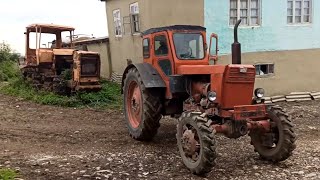 Tractor T-40 pulls DT-75.