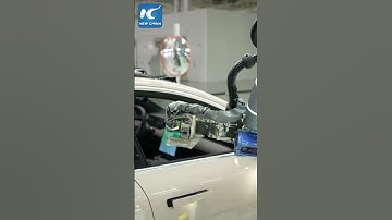 AI robots help conduct quality inspections on NEV production lines