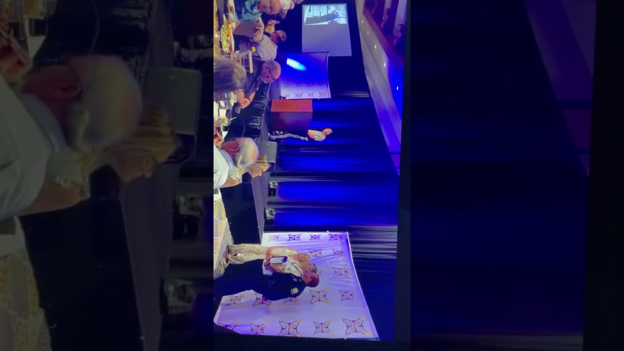 Bob Dunker receiving distinguished lifeguard service award in absentia