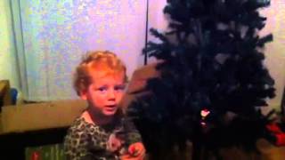 Ruby decorating A Christmas tree for the first time Novembe