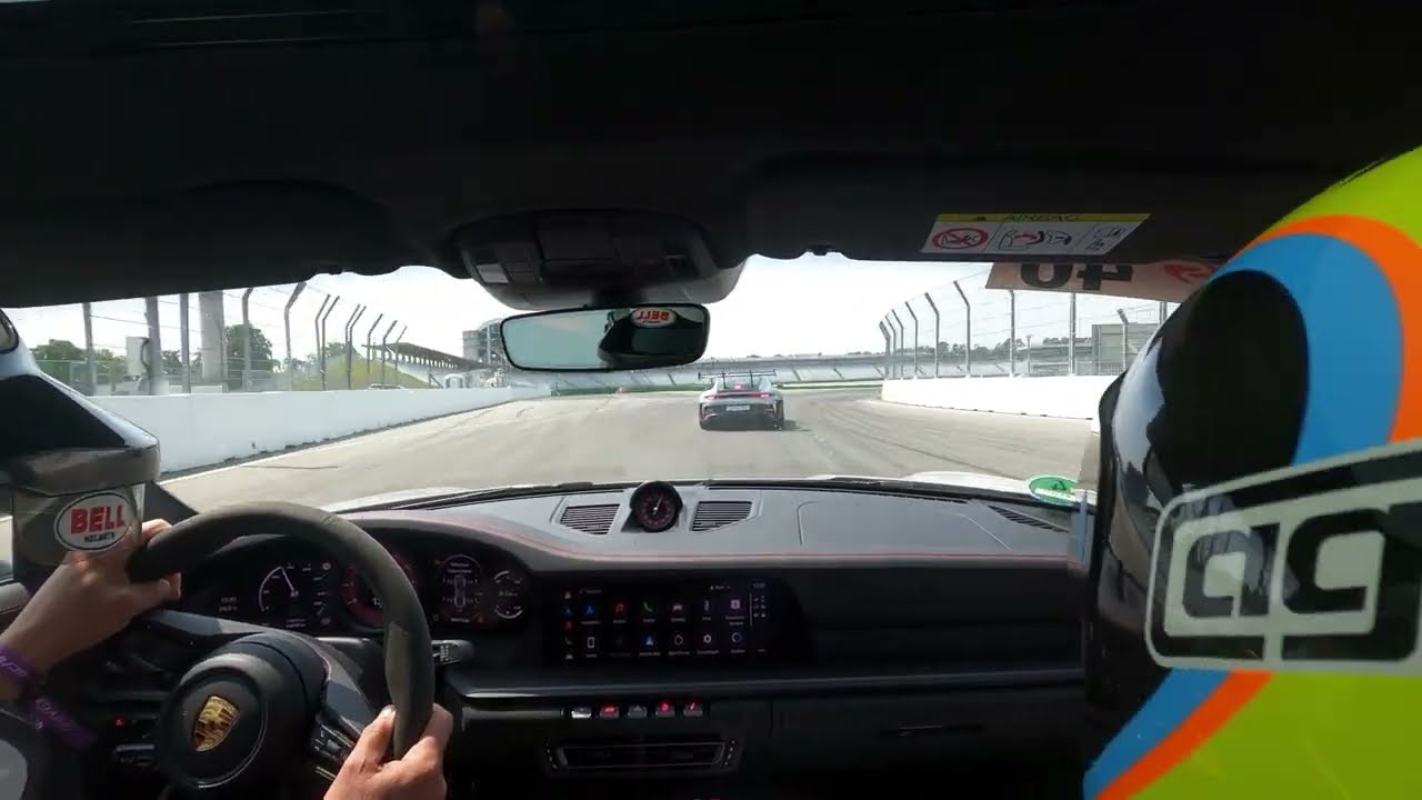 Porsche 992 GTS behind 992 GT3RS racetrack Hockenheimring in traffic