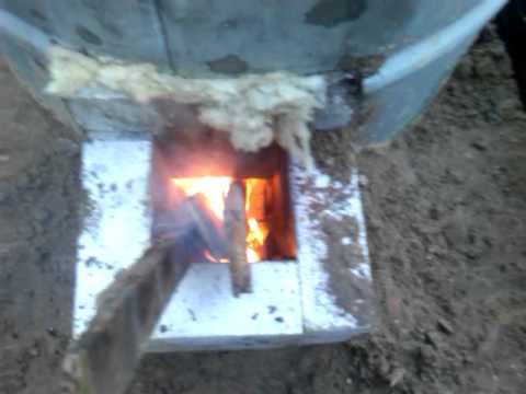 Re built rocket stove - first burn - YouTube
