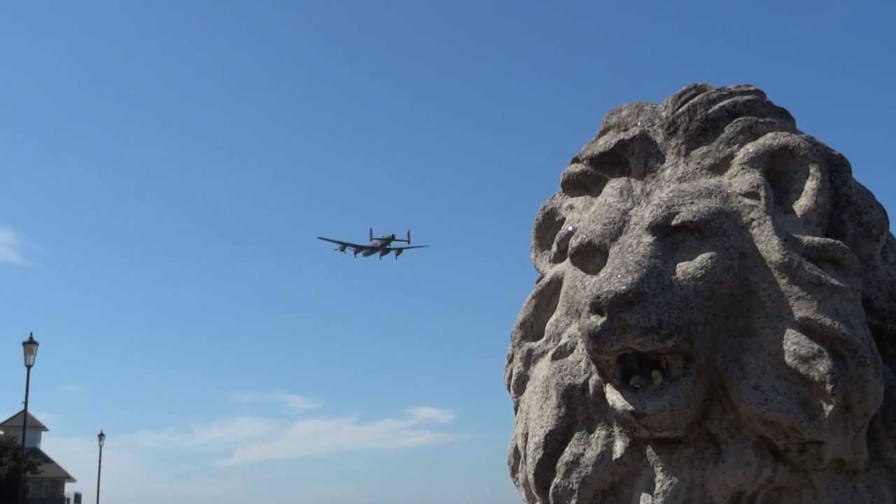 LANCASTER BOMBER FLYING OVER COWES ROYAL YACHT SQUADRON