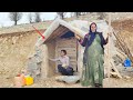 Quick action by nomadic family, insulating the hut's entrance balcony in winter