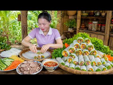 Single girl making handmade colorful Pho rolls with meat and vegetables to sell at market