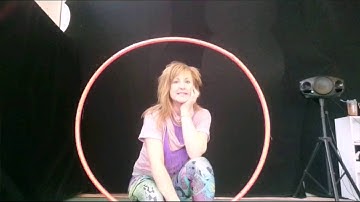 Hula hoop trick: behind the back elbow pass
