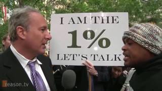 Socialist Protester Debates Wealthy Businessman Peter Schiff