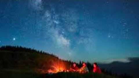 enjoying a campfire in the middle of the night
