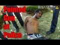 Armed Suspect Points Gun at Officer During Chase