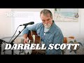 Darrell Scott Talks "New Moon, New Music", Rereleasing Modern Hymns, and Malcolm Holcombe