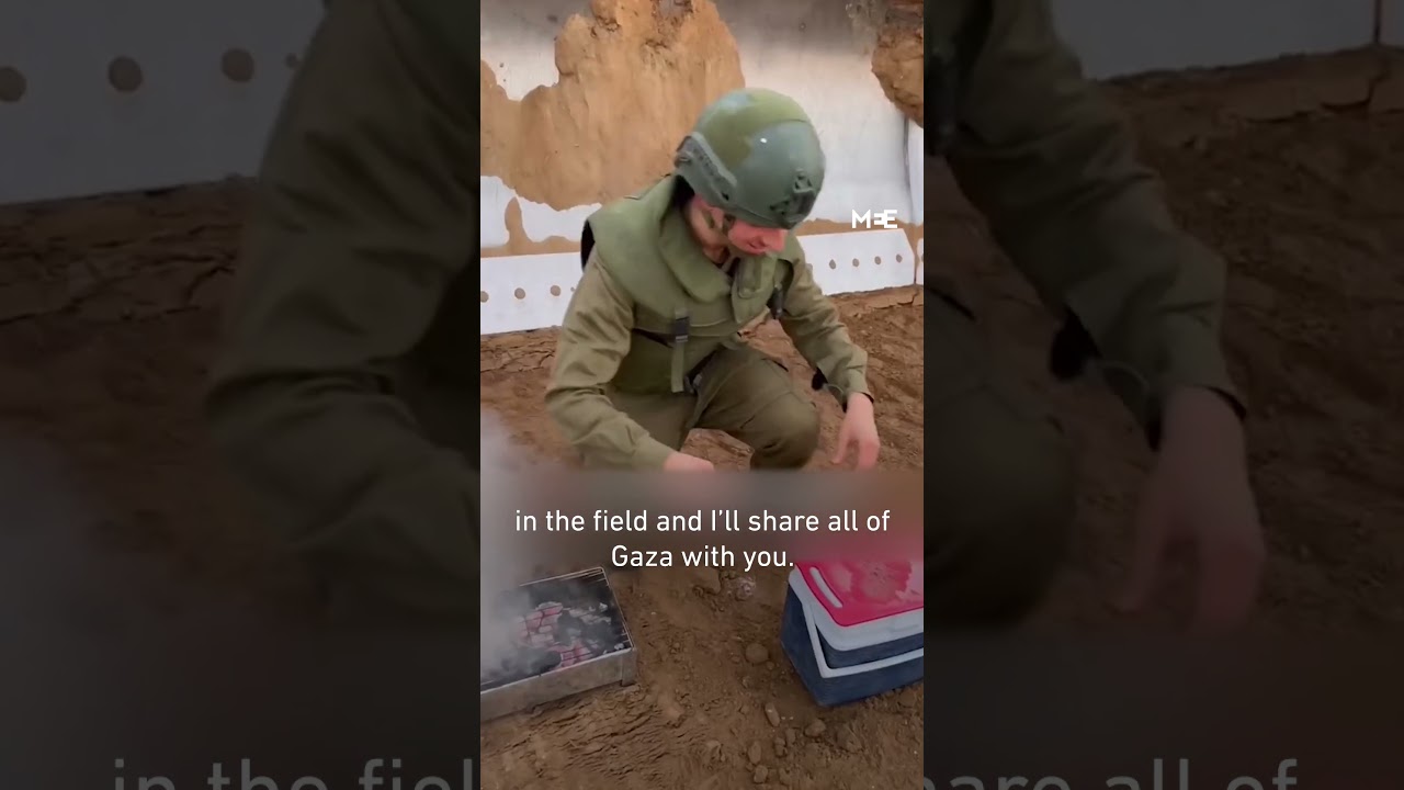 A soldier makes a video of himself cooking steak in war torn Gaza