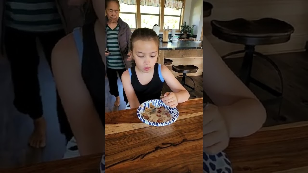 CUTE GIRL EATING CEREAL 