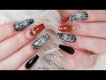 Halloween nails with spider web and crystal spider. Halloween nail art