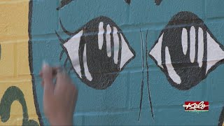 Young artist, who was in legal trouble, inspires ‘Art Walls’