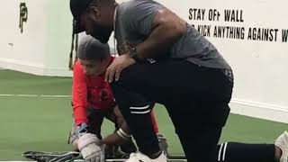 Trevor Baptiste demonstrates clamp and how to pinch during faceoff with Ben Logan at FaceOff Academy