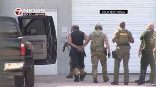 Video of mail bomb suspect in custody, handcuffed