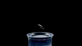Slow Motion In Coin Dropping To The Water