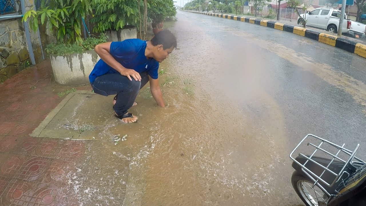Unclogging Culvert Drain Rain Water On Street Road - YouTube