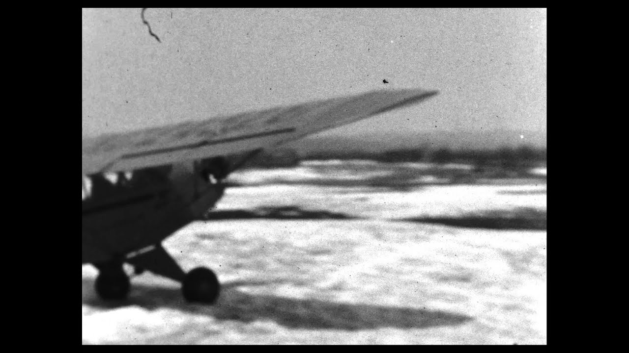 Single engine ski plane taking off and landing - 1940