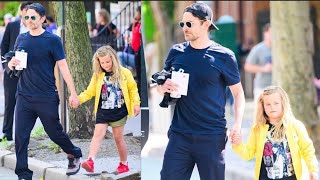 Bradley Cooper the doting dad holds hands with daughter Lea De Seine, seven -