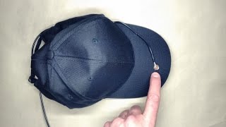 Baseball cap with integrated microphone.