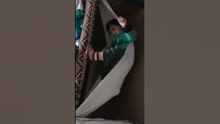 Baby swinging in funny style