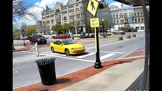 Yellow car uses crosswalk